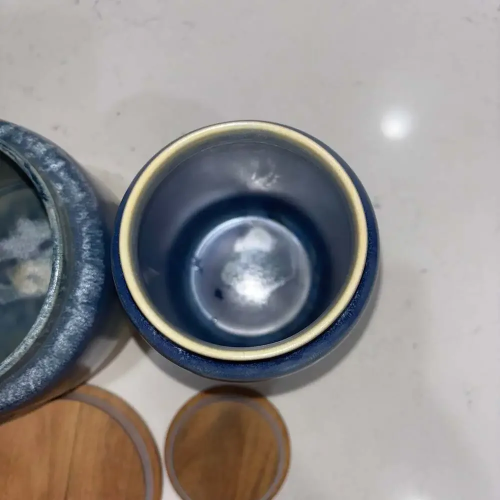 Set of 2 World Market Blue and Cream Ceramic Canisters Wooden Lids